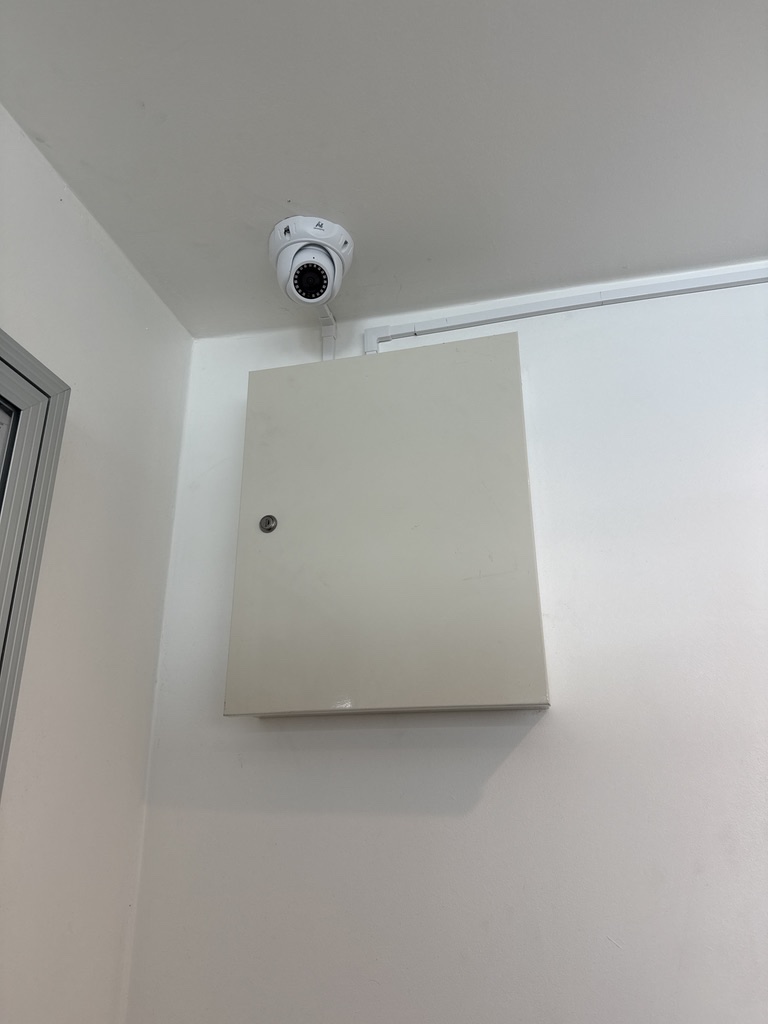Installed camera above an equipment cabinet.