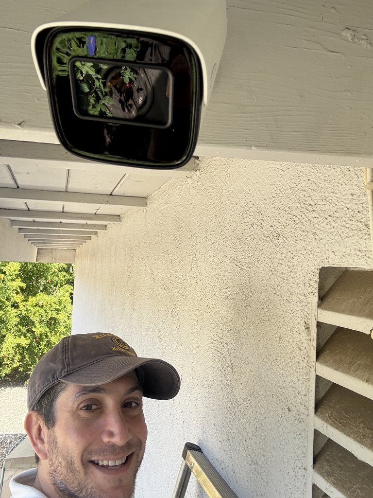 Mike, owner of Tech Secure 360, installing a security camera at a Los Angeles property